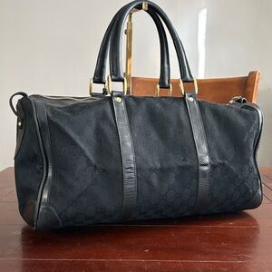 Gucci black canvas GG monogram and black leather trim weekender duffle bag